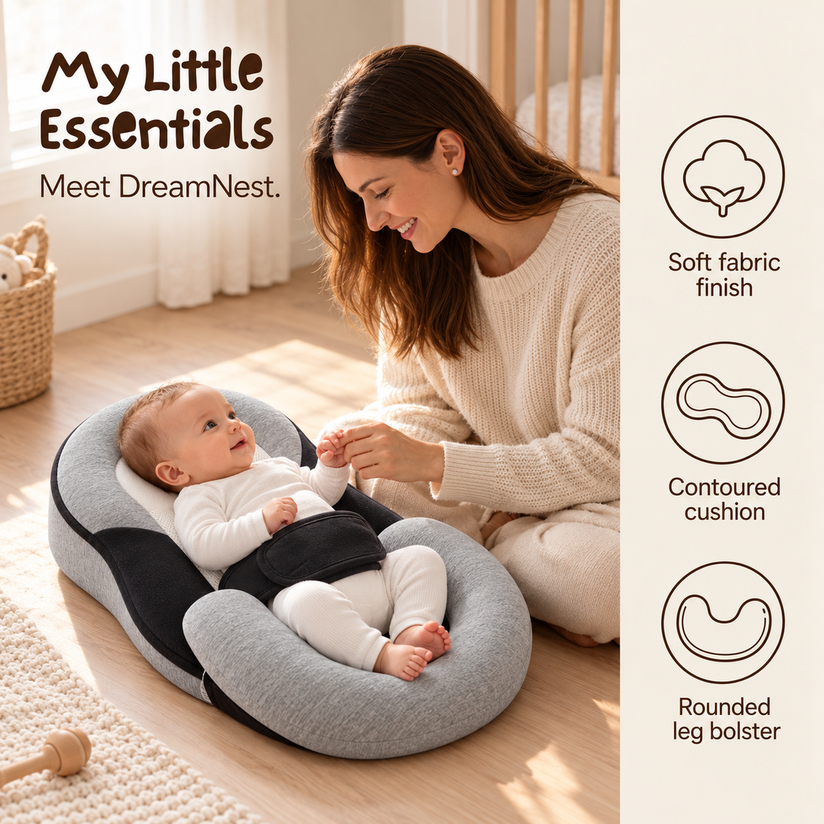 DreamNest with an awake baby and parent beside it; soft fabric finish, contoured cushion and rounded leg bolster